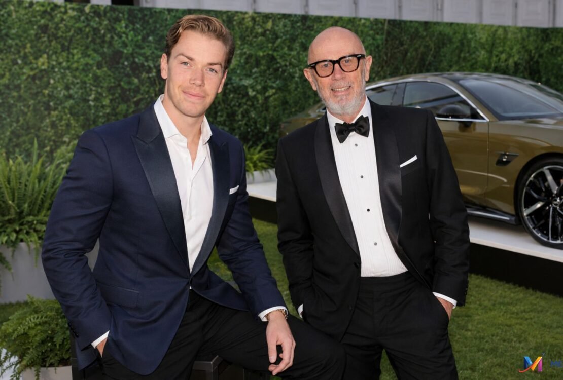 Neil Poulter with his son Will Poulter at a formal event.